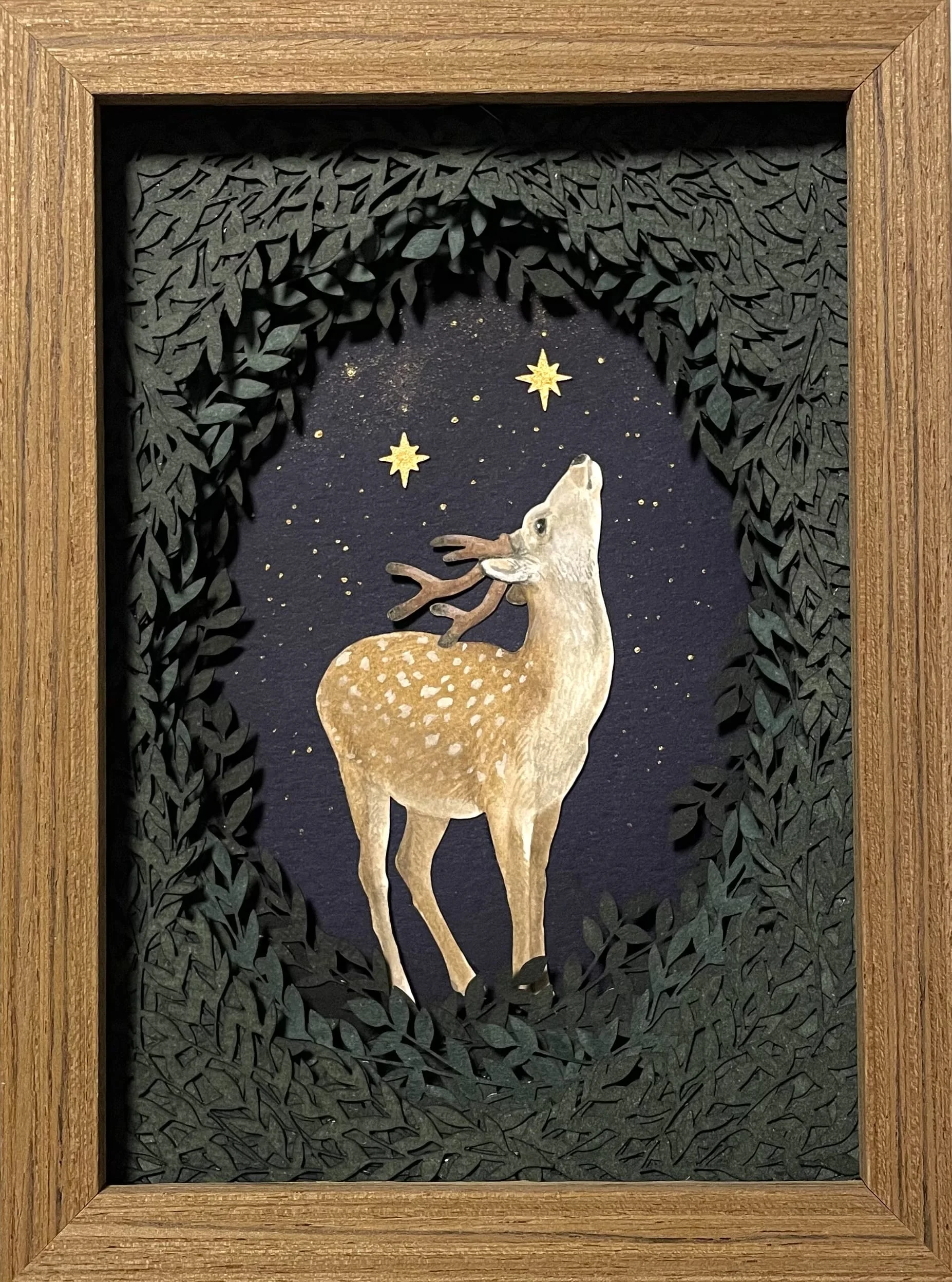 Small deer collage with glowing stars