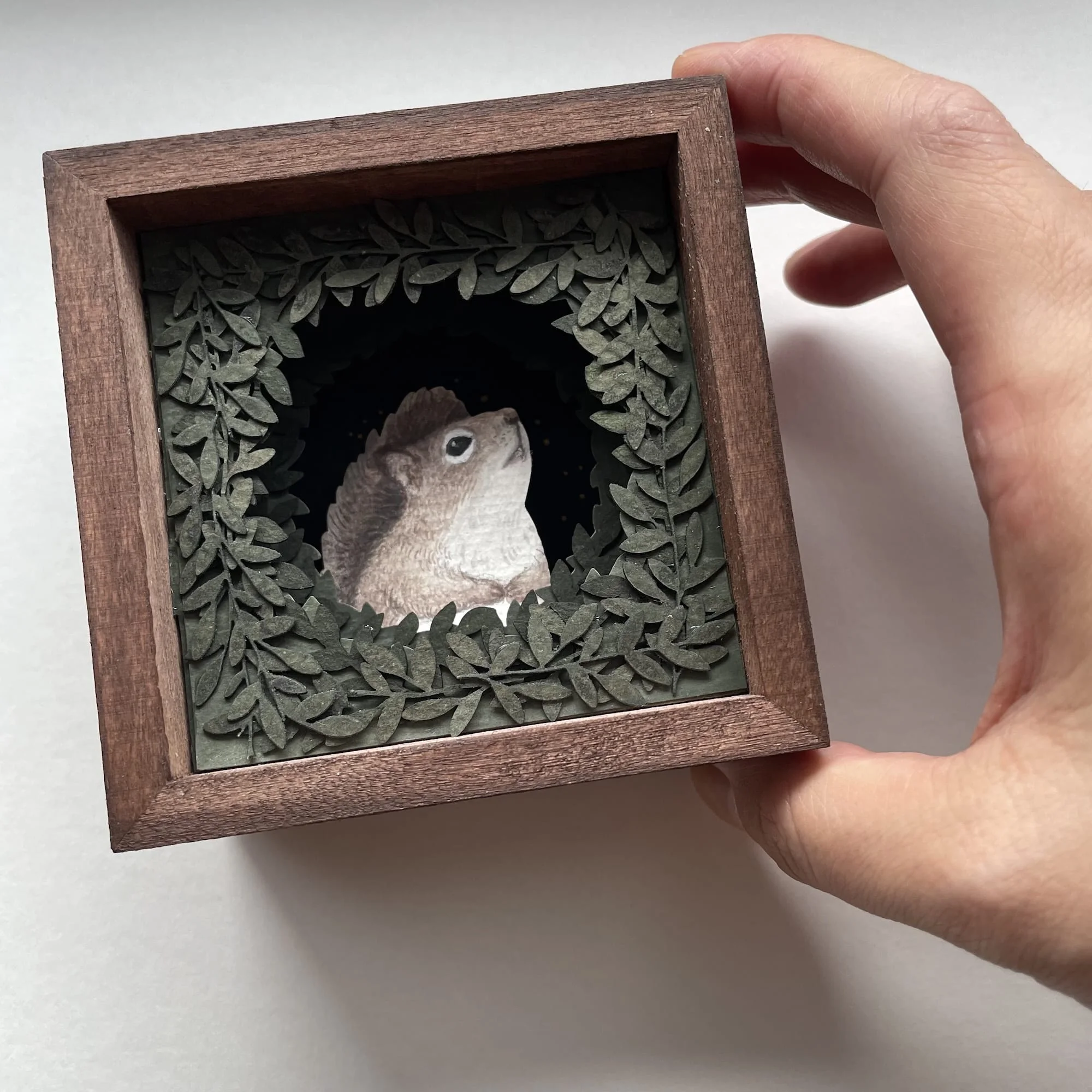 Collage of a squirrel peeking out from foliage