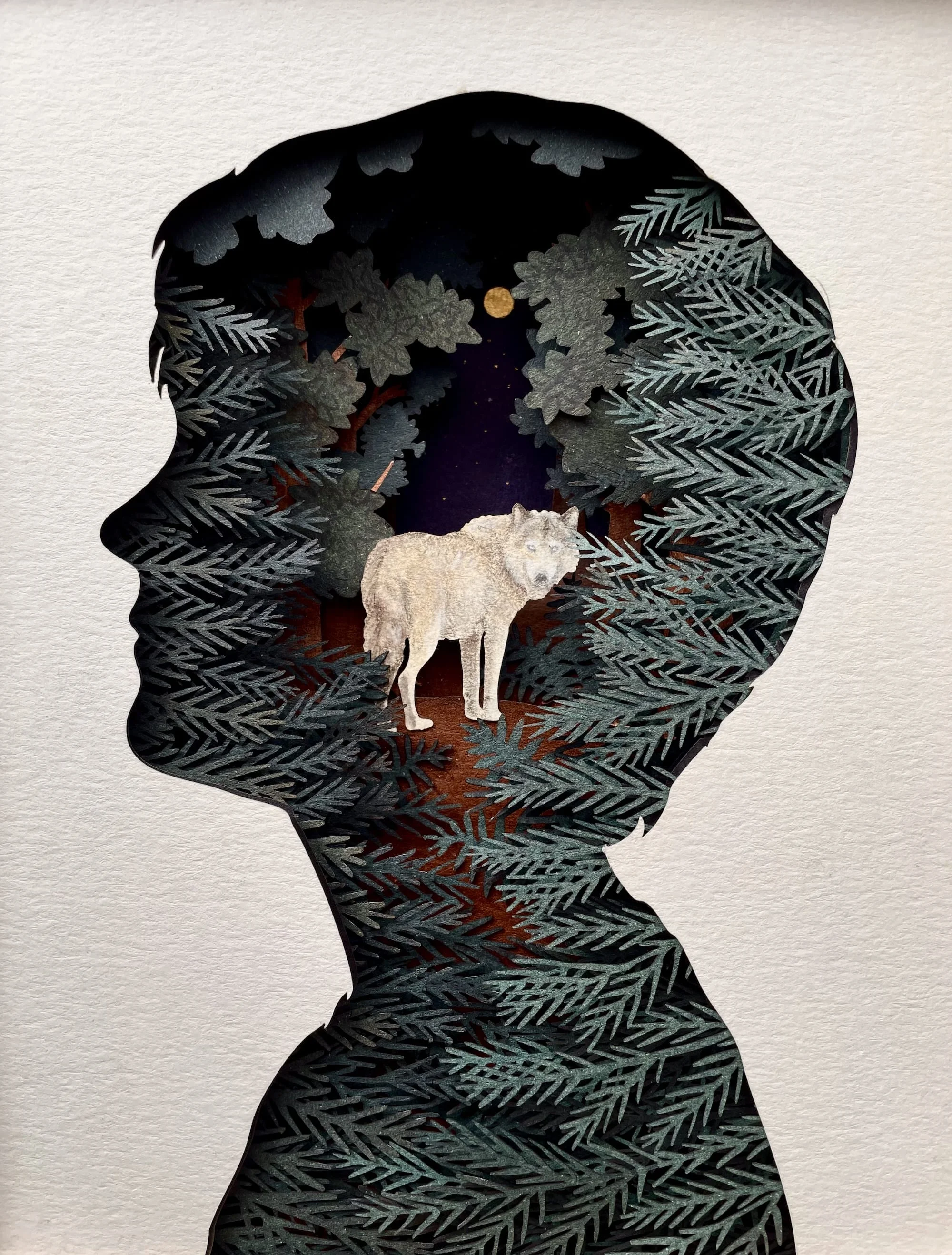 A collage featuring woodland creatures, a wolf amid a forest