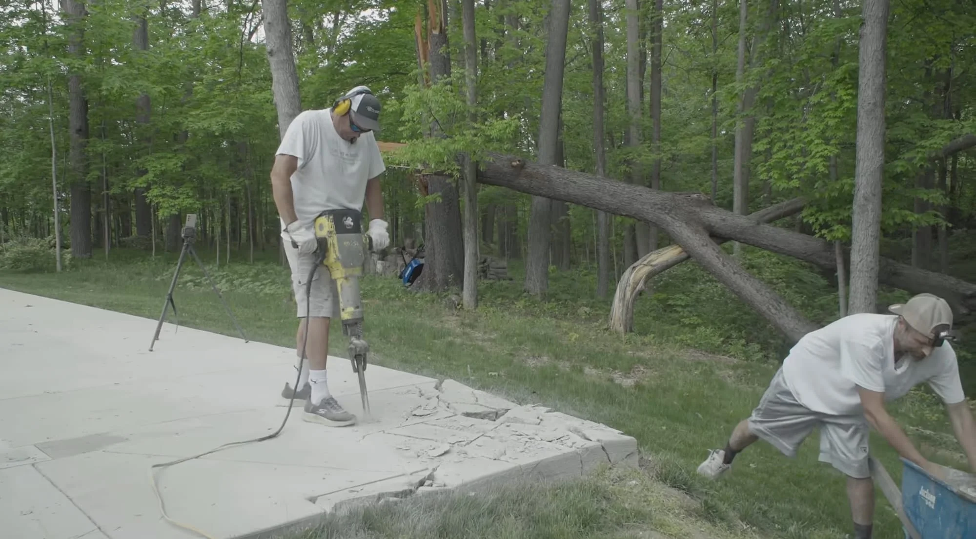 A still from the movie 'The History of Concrete' showing two men jackhammering